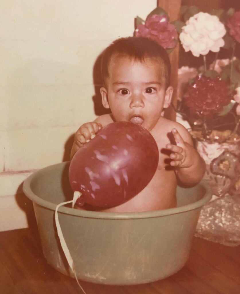 Jalyll at 8 months old playing in a “palangana” with a balloon